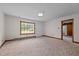 Bright living room with a door and window showcasing the expansive surroundings at 901D Gibson Rd, Mebane, NC 27302