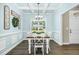 Light-filled dining room with a decorative wreath and a view to the front yard at 93 Fallingbrook Dr, Kenly, NC 27542