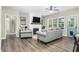 Cozy living room with a fireplace, neutral paint, and a comfortable seating arrangement at 93 Fallingbrook Dr, Kenly, NC 27542