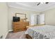 Comfortable bedroom with a large dresser and neutral color scheme at 93 Fallingbrook Dr, Kenly, NC 27542