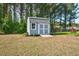 Charming backyard shed that provides ample storage space and adds to the property's appeal at 93 Fallingbrook Dr, Kenly, NC 27542