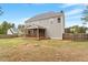 Backyard with a screened porch, basketball hoop and mature trees provide privacy and space for recreation at 101 Jewell Farm Lane, Holly Springs, NC 27540