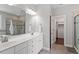 Spacious bathroom with double vanities, walk-in closet, and glass-enclosed shower at 101 Jewell Farm Lane, Holly Springs, NC 27540