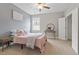 Comfortable bedroom with a double bed, stylish decor, and lots of natural light at 101 Jewell Farm Lane, Holly Springs, NC 27540