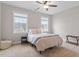 Neutral bedroom with natural light, carpet, and modern furnishings at 101 Jewell Farm Lane, Holly Springs, NC 27540