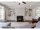 Cozy living room showcasing built-in shelving, a fireplace, and comfortable seating, creating a perfect space at 101 Jewell Farm Lane, Holly Springs, NC 27540
