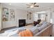 Comfortable living room with fireplace, built in shelving, and plush seating at 101 Jewell Farm Lane, Holly Springs, NC 27540
