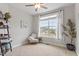 Cozy office featuring a large window, ceiling fan, corner shelving, and chair creating a tranquil atmosphere at 101 Jewell Farm Lane, Holly Springs, NC 27540