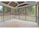 Spacious screened porch with a wood floor and view of the backyard at 101 Jewell Farm Lane, Holly Springs, NC 27540