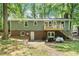 The exterior elevation features a new deck, brick accents, and a spacious backyard at 104 Argyle Ct, Garner, NC 27529