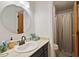 Cozy bathroom with a modern sink, a tiled shower, and a neutral color scheme at 104 Argyle Ct, Garner, NC 27529