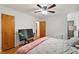 Bedroom with hardwood floors, soft lighting, closet, and easy access to an attached bathroom at 104 Argyle Ct, Garner, NC 27529