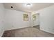 Well-lit bedroom with carpet, large window, and closet creates a comfortable and serene space at 104 Argyle Ct, Garner, NC 27529