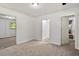Bedroom with light colored carpet, a mirrored closet, and white walls at 104 Argyle Ct, Garner, NC 27529