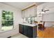 Modern kitchen area offering sleek appliances, beautiful countertops, and a seamless flow to the dining area at 104 Argyle Ct, Garner, NC 27529