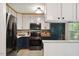Well-equipped kitchen featuring stainless steel appliances and modern cabinetry for cooking convenience at 104 Argyle Ct, Garner, NC 27529