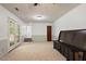 Carpeted living room featuring neutral paint colors and a set of french doors at 104 Argyle Ct, Garner, NC 27529