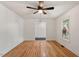Bright living room with hardwood floors, neutral walls, and a ceiling fan for added comfort at 104 Argyle Ct, Garner, NC 27529
