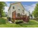Beautiful backyard featuring a wooden deck, manicured landscaping, and easy access to the lawn and patio at 104 Caley Rd, Apex, NC 27502