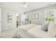 Bright bedroom with neutral walls, double windows, and a decorative metal bedframe at 104 Caley Rd, Apex, NC 27502