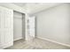 Light-filled bedroom with a large closet, plush carpeting, and fresh paint at 104 Caley Rd, Apex, NC 27502