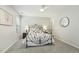 Inviting bedroom featuring a decorative iron bed frame, carpet, and ceiling fan at 104 Caley Rd, Apex, NC 27502