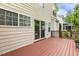 Outdoor deck featuring a wood plank surface and direct access to the house via a sliding glass door at 104 Caley Rd, Apex, NC 27502
