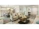 Open-concept living area with hardwood floors and neutral decor at 104 Caley Rd, Apex, NC 27502