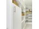 Well-organized pantry with white shelving and storage baskets for optimal organization at 104 Caley Rd, Apex, NC 27502