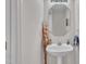 Bathroom featuring a single sink vanity, a mirror, and decorative accents at 105 Breakers Pl, Cary, NC 27511