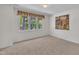 Bedroom with neutral carpet, a window with patterned valance, and decorative artwork at 105 Breakers Pl, Cary, NC 27511