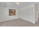 This bedroom features neutral carpet and access to additional rooms and closet space at 105 Breakers Pl, Cary, NC 27511