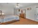 Bedroom featuring hardwood floors, a ceiling fan, and exterior access at 105 Breakers Pl, Cary, NC 27511