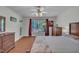 Bedroom featuring hardwood floors, a large window, and matching wood furniture at 105 Breakers Pl, Cary, NC 27511