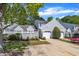 Beautiful home with gray siding, one-car garage, and a quaint fenced-in front yard space at 105 Breakers Pl, Cary, NC 27511