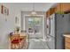 Cozy breakfast nook with view to the outdoors, open to kitchen with stainless steel fridge and ample cabinet space at 105 Breakers Pl, Cary, NC 27511