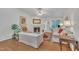 Sun-filled living room featuring hardwood floors, fireplace, and backyard access at 105 Breakers Pl, Cary, NC 27511