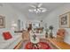 Inviting living room showcasing high ceilings, hardwood floors, and a cozy seating area at 105 Breakers Pl, Cary, NC 27511