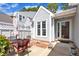 Outdoor patio featuring a table, chairs, white walls, a closed umbrella, and a sliding glass door at 105 Breakers Pl, Cary, NC 27511