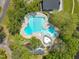 Aerial view of a community pool featuring lane lines, a baby pool, and surrounding trees at 105 Breakers Pl, Cary, NC 27511