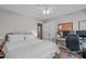 Bedroom featuring neutral walls, a work space, and a bed with white linens at 107 Candy Apple Ct, Cary, NC 27513