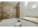 Bathroom with a tub and shower combo and decorative tile at 108 Deepwood Cir, Garner, NC 27529