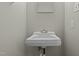 Half-bath with a sink and wall mirror at 108 Deepwood Cir, Garner, NC 27529