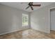 Bedroom featuring neutral walls, tile flooring and a window at 108 Deepwood Cir, Garner, NC 27529