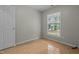 Cozy bedroom with tile flooring, a window and closet at 108 Deepwood Cir, Garner, NC 27529