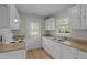 Updated kitchen featuring modern appliances, granite countertops and white cabinets at 108 Deepwood Cir, Garner, NC 27529