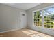 Inviting living room featuring tile floors, a large window, and a white front door at 108 Deepwood Cir, Garner, NC 27529