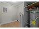 The utilitarian room features a water heater, and electrical panel at 108 Deepwood Cir, Garner, NC 27529