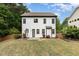 Well-maintained backyard featuring a lush lawn, privacy fence, patio, and flowering plants at 1209 Shasta Daisy Dr, Wake Forest, NC 27587