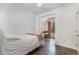 Cozy bedroom featuring a single bed, soft pink accents, and an alcove seating area at 1209 Shasta Daisy Dr, Wake Forest, NC 27587